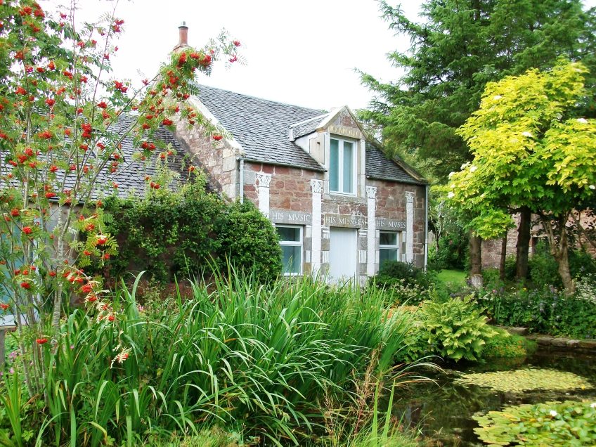 Figure 0.11: Ian Hamilton Finlay, Temple of Apollo at Little Sparta, 1980, Stonypath, near Edinburgh. Courtesy of the Wild Hawthorn Press and the Estate of Ian Hamilton Finlay. Photograph: Joel Robinson.